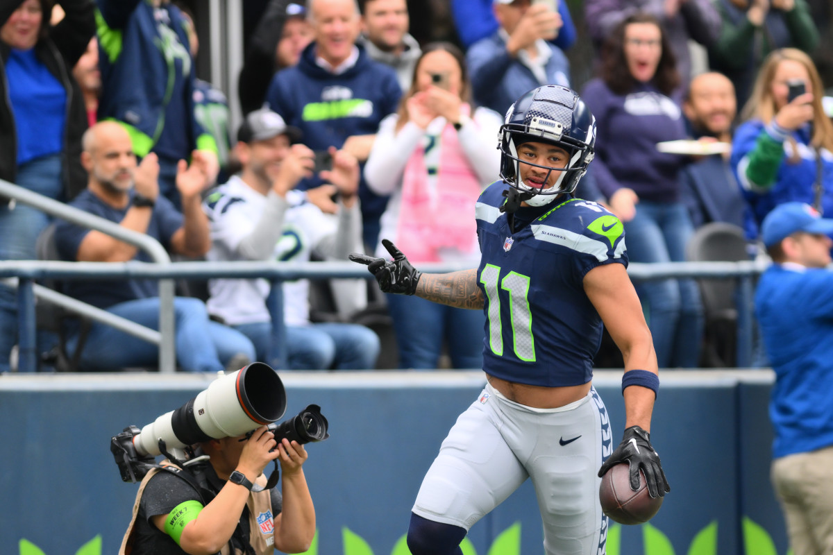 Seattle Seahawks wide receiver Jaxon Smith-Njigba (11) celebrates after scoring a touchdown against the Arizona Cardinals during the first half at Lumen Field.